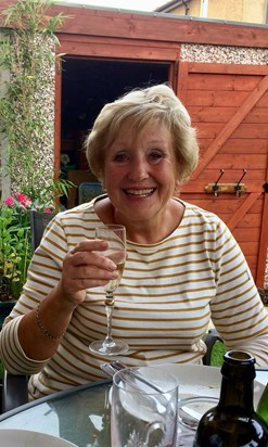 Mum enjoying a glass of wine in the garden