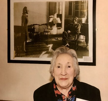 Betty at RAM in front of her picture as a student there