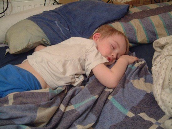 Ben aged 4 sleeping on Mummy's bed