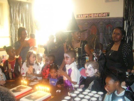 Lisa with L'shae and Kaiden about to blow their candles out