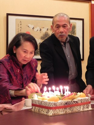 Aunt Susan lighting Dad's 70th birthday candles