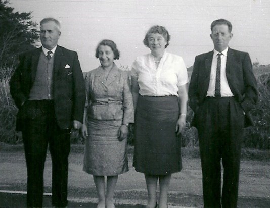 Early photo of Mum & Dad with Polly and Jimmy.