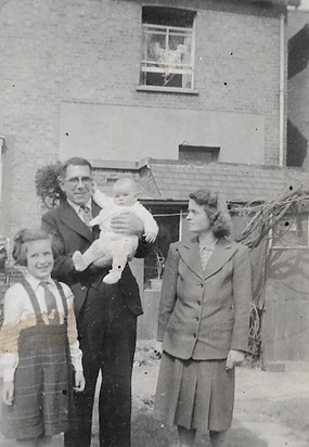 Richard being held by his father alongside his Mother Barbara and sister Mary 