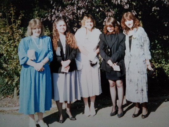Julie in the middle, all lined up posing at a friend's wedding, not sure now of the date?