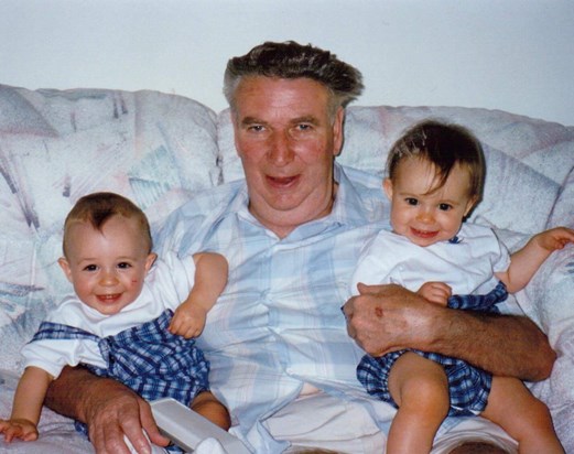 Bob with his twin grandchildren, John and Samantha, on a visit to Maryland in 1995.