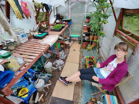 Mara in Grandads greenhouse, or 'shop' as she made it.