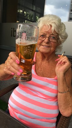 My Nan this is how I will always remember you. Loving life with a pint of lager and a ciggy. We all Miss you so much already. Love you forever and always 
