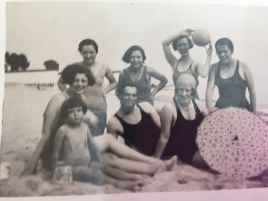Dennis at the beach with his mother Pola and friends