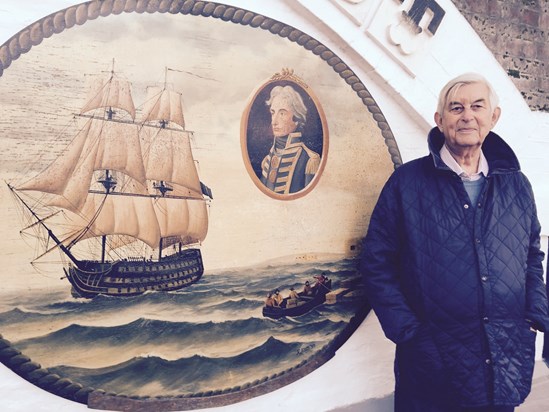 Dennis next to Lord Nelson and painting of the “Victory”