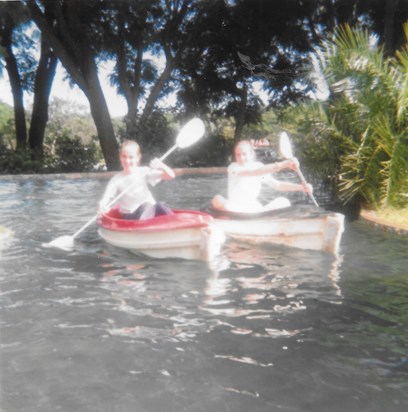 Deborah and Anita paddling downriver at Greenwood Park Salisbury Rhodesia 1979