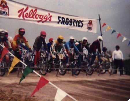 Mark (yellow helmet) at starting gate in BMX race meeting Bournemouth