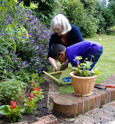 Mum and Luke gardening