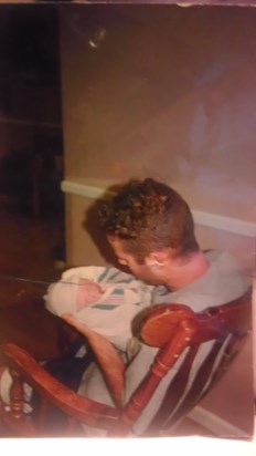 Danny holding Milla the day she was born! So sweet!