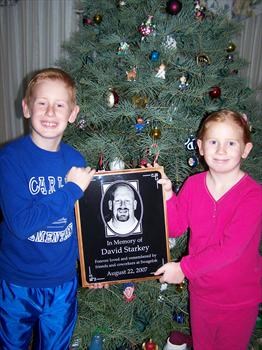 Kids with memorial plaque