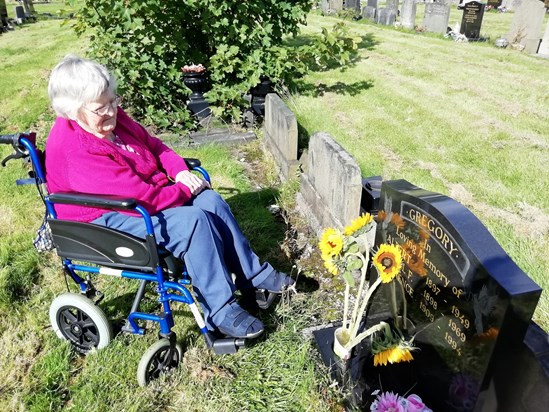 Mum visiting her parents graveside