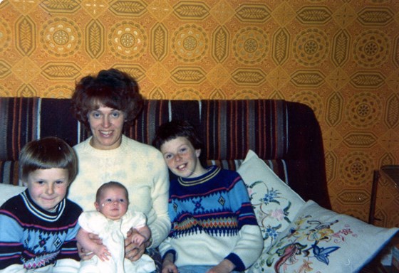 Mum with David (right), Peter (left) and Samantha (middle)