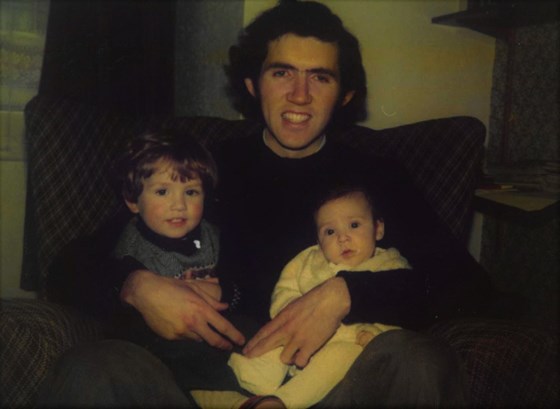 Baby Dave, with his big brother in his Dad's arms. 