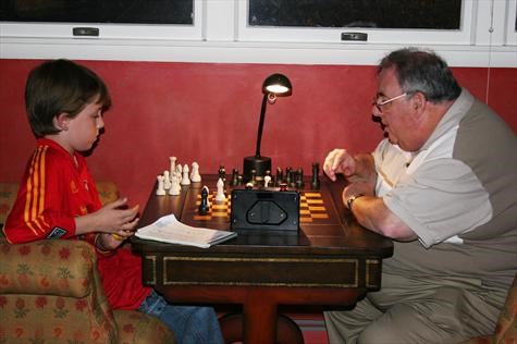 Fred and Nicholas square off in a chess match