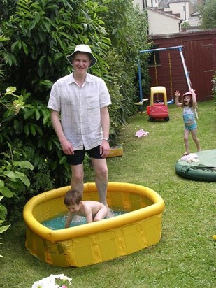 George in a paddling pool