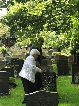 Aurelia and son Dario visiting graves of husband Alan and parents George and Marjorie Hall