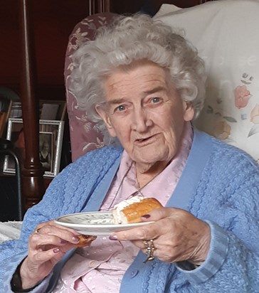 Mum enjoying her favourite cake - May 2020