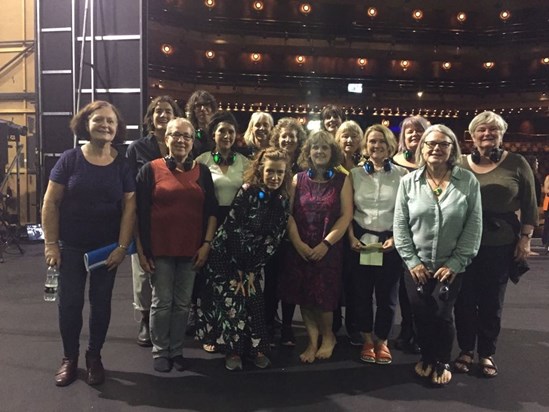 Helen and the choir on stage at the Barbican for a rehearsal of Memorial in 2018