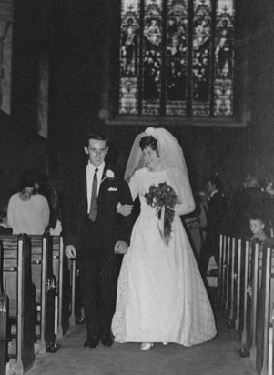 Mum & Dad walking down the aisle as a married couple 1969