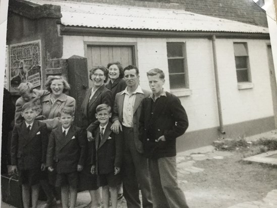 Albert with Violet, Betty, Pauline and Roger. The boys waiting for the coach back to London.