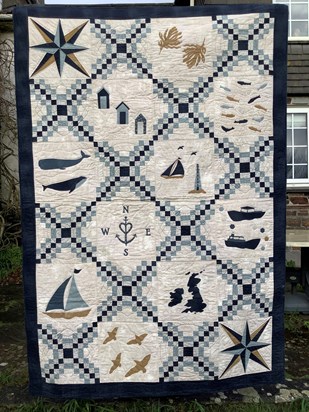 A beautiful hug in a quilt made by Ruth Dobbins for Dad