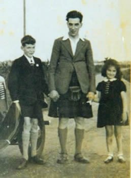 Kay pictured with her father and brother in about 1937.