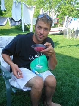 THIS IS STU AT HIS HOUSE HAVING A DRINK  WITH FRIEND IN THE BACK YARD  RIP