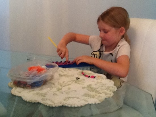 Emma doing her loom bands , mummy be proud! X