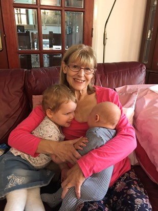 Christine cuddling her precious grandchildren 