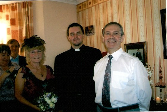 With the priest when we renewed our vows