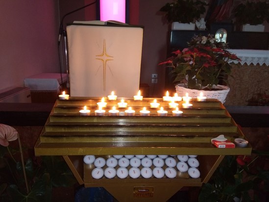 Candles lit in memory of John in Lake Garda 