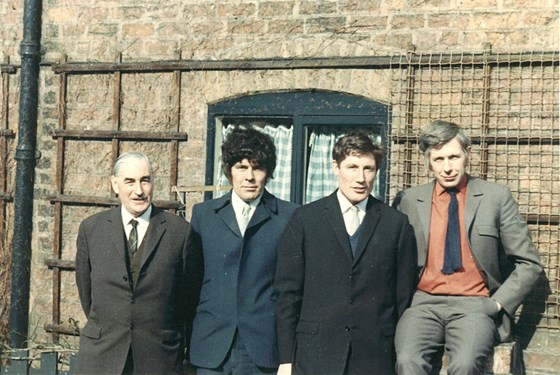 Brian (second left) with his father Charlie and brothers Frank and David (far right)