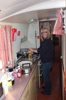Mater Bates 1st mate cooking breakfast — with Carol Garratt.