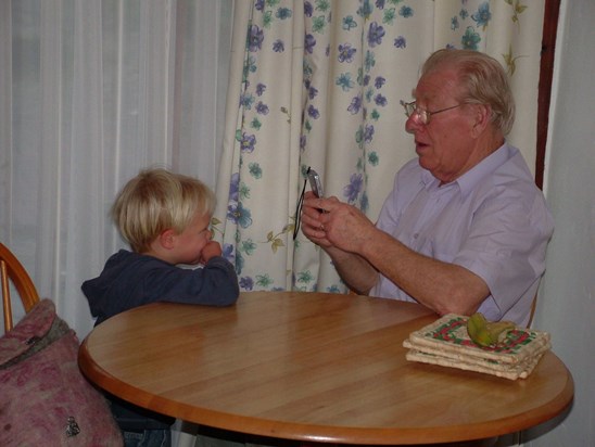 Brian demonstrating his prowess with modern technology with Joel (2006)