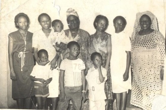 Iyetade, far left, with grandpa and grandma Idowu and clan of cousins