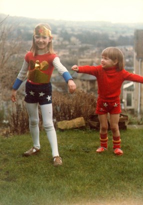 Kate and Laura being Wonderwoman and supergirl