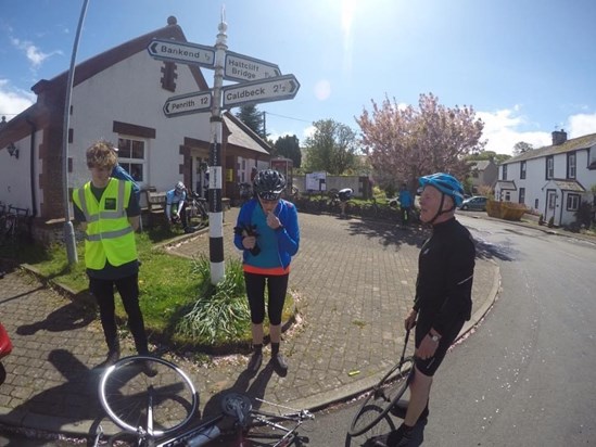 David holding up  proceedings at the pit stop with a flat tyre at the Solway charity ride. With In laws Ian and Julie