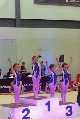 Charlie coming first at her gymnastics.