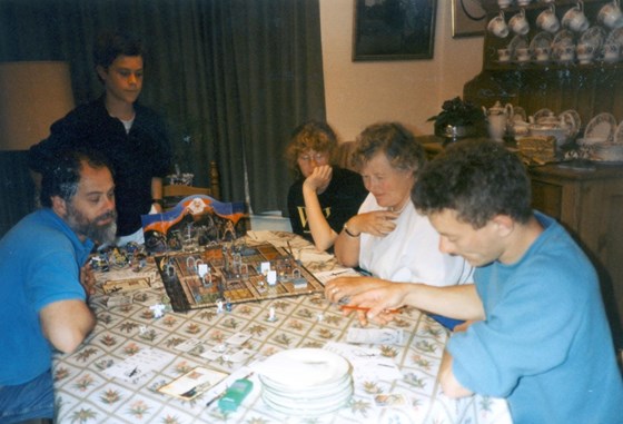 Barbara learning to play a science fiction fantasy game called Hero Quest with the Guest boys. 