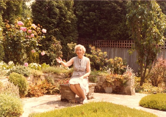 Joan as her gentle welcoming self, in the garden she so loved.
