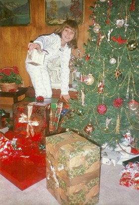 William's sister, Natalie, playing Santa at home in Danville - 1996