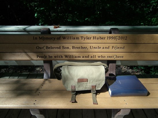 William rests on his bench next to his photo album, September 23, 2015