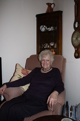 Mum sitting comfortably at the cottage.