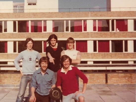 Showing off a Trophy at University