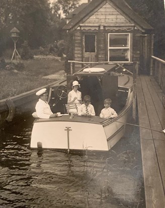 The Robinson family on the broads in their Robin