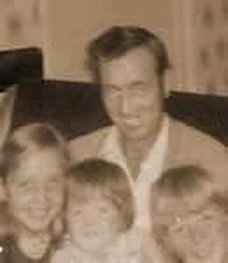 Dad, Eirlys, Dewi and myself in the middle.